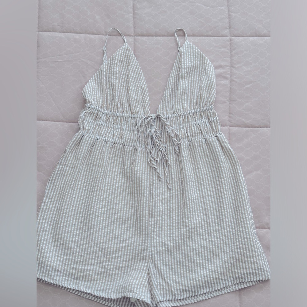 Never worn! Vacation Getaway Romper. Tan and white striped.